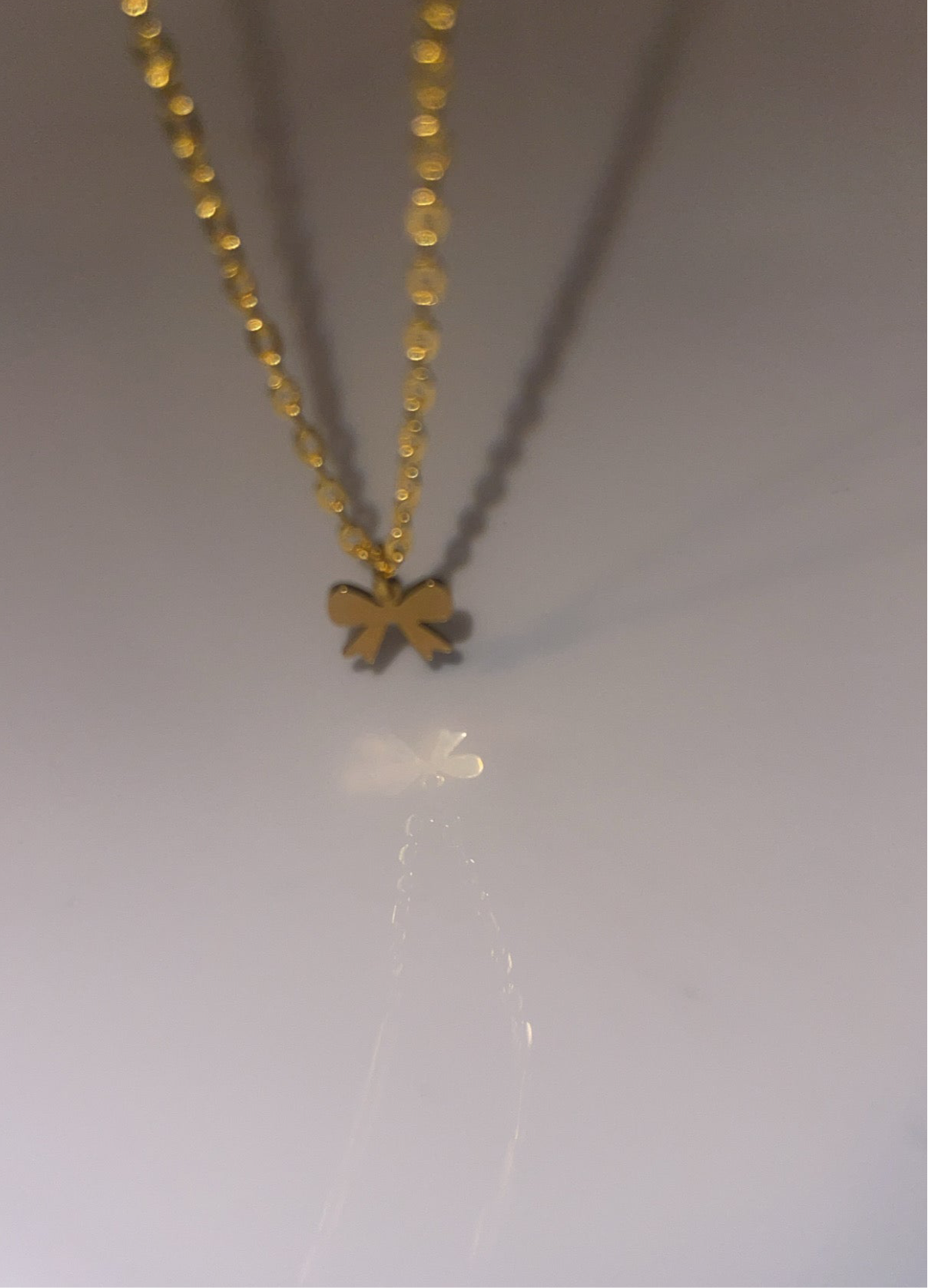 Elegant Gold Bow Pendant Necklace