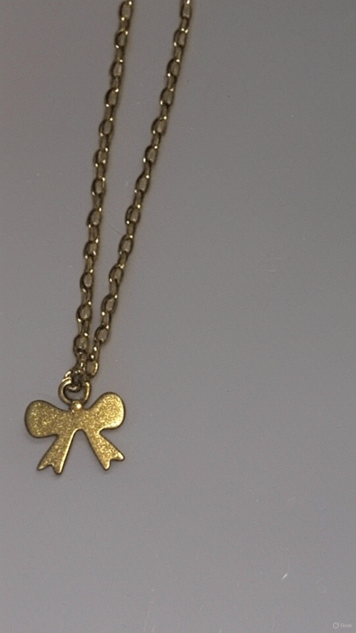 Elegant Gold Bow Pendant Necklace